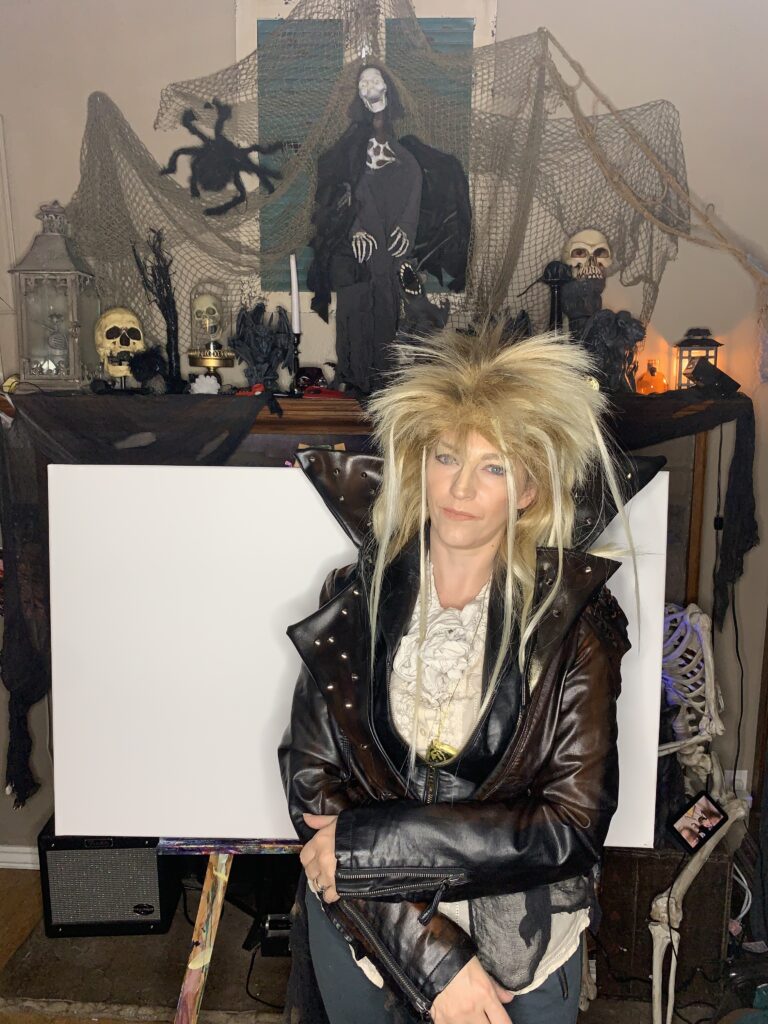 Cassondra eastham in a labyrinth costume starting a painting class 